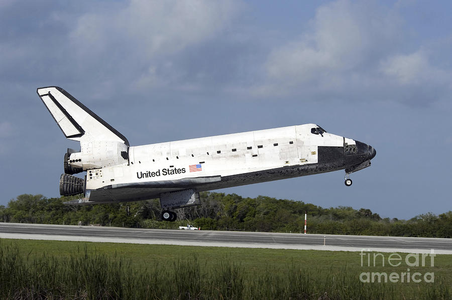 Space Shuttle Discovery Lands On Runway Photograph by Stocktrek Images