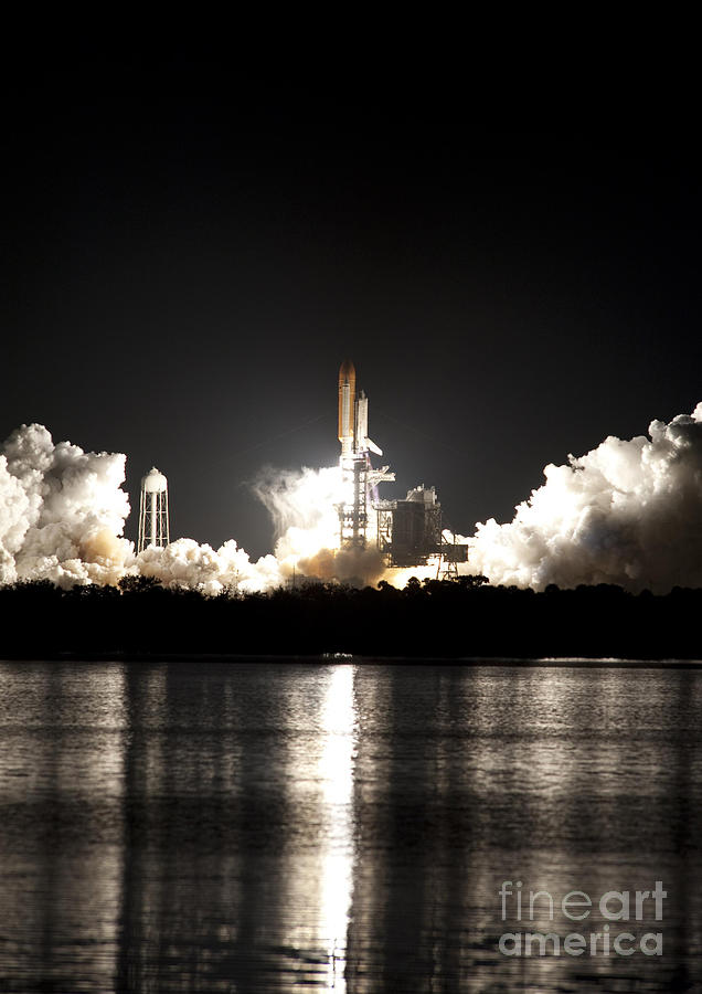 Space Shuttle Discovery Lifts Off Photograph by NASA/Ben Cooper