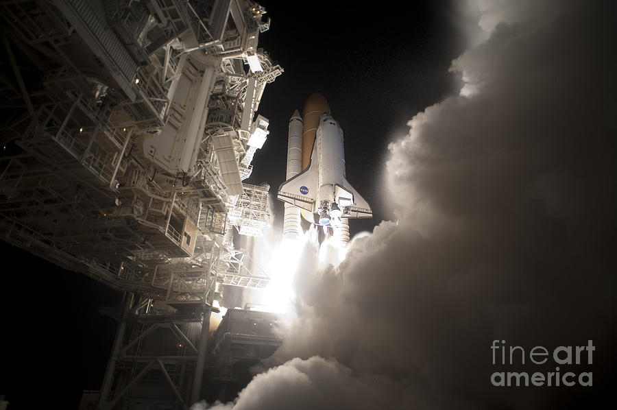 Space Shuttle Discovery Lifts Off Photograph by NASA/Tony Gray & Tom Farrar
