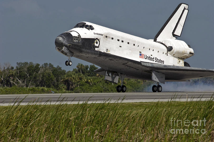 Space Shuttle Endeavour Touches Photograph