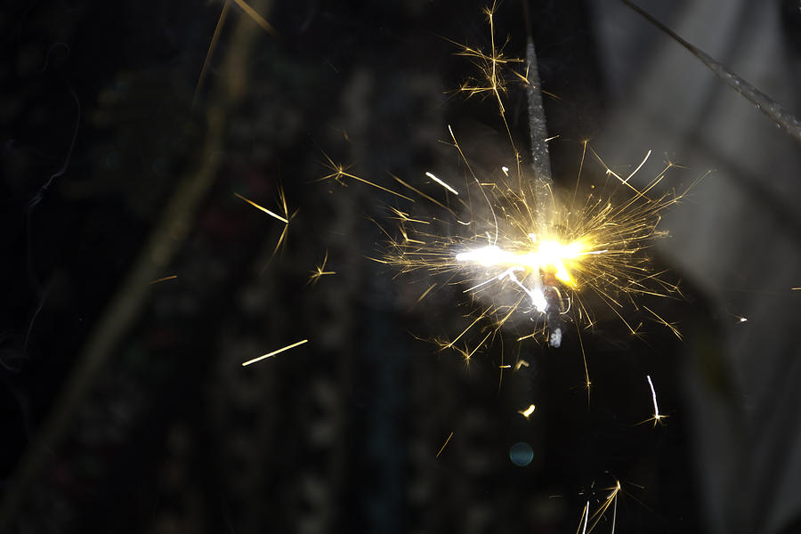 Sparks from a hand held sparkler during Diwali celebrations Photograph by Ashish Agarwal