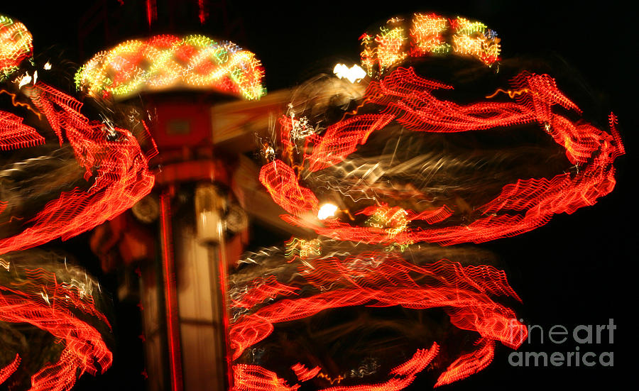 Spinning Amusement At Night Photograph by Susan Stevenson