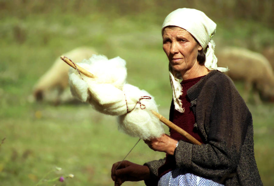 Spinning wool Photograph by Emanuel Tanjala