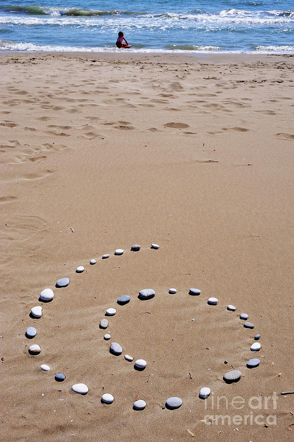 Beach Photograph - Spiral of pebbles on beach by Sami Sarkis