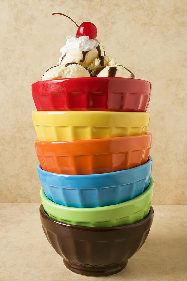 Bowl Photograph - Stack of colored bowls with ice cream on top by Garry Gay