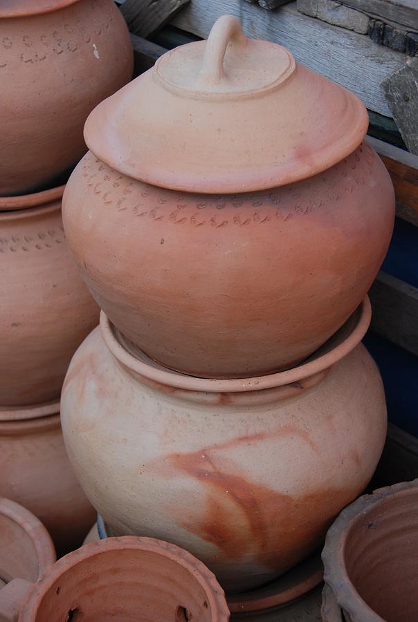 Stack of waterpots for sale Photograph by Fran Woods