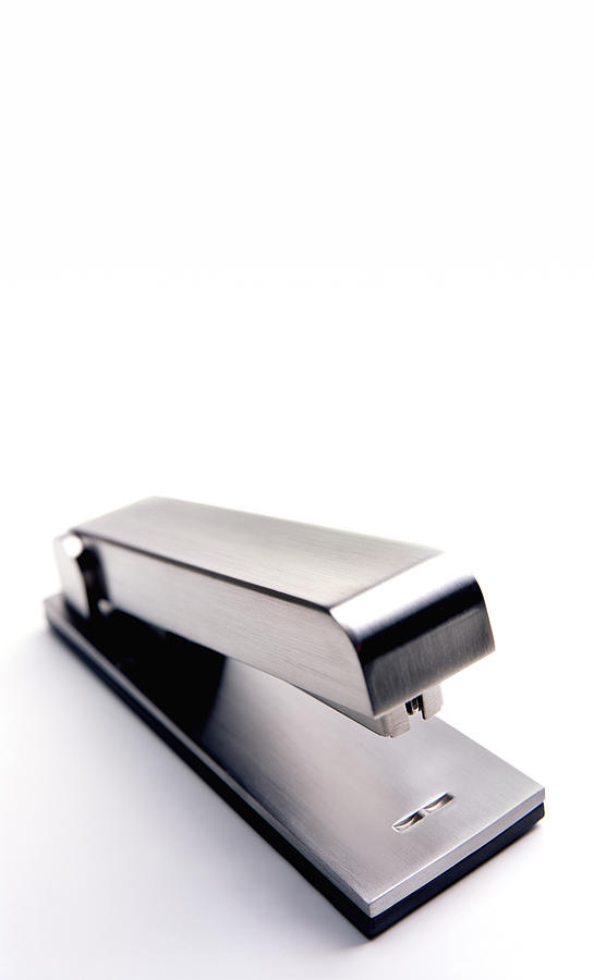 Stapler With Copy Space Photograph by Peter Dazeley
