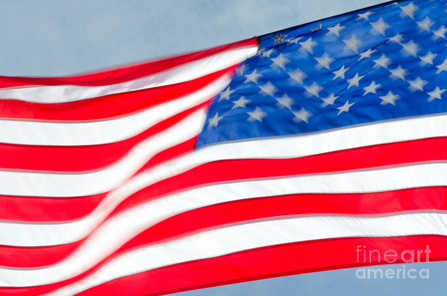 Stars And Stripes Waving Usa Flag In A Strong Wind Photograph