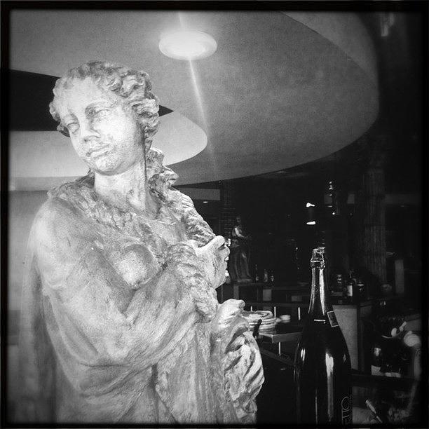 Orlando Photograph - Statue and wine by James Roberts