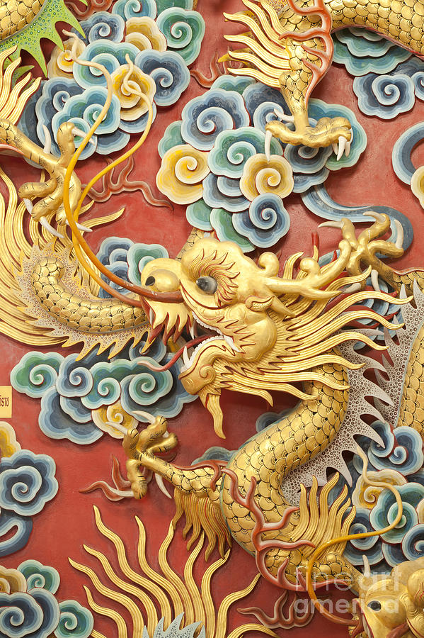 Statue of golden dragon on the wall  Photograph by Anek Suwannaphoom