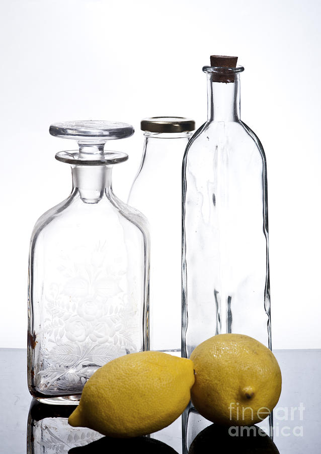 Still life of bottles  and lemons Photograph by Ilan Amihai