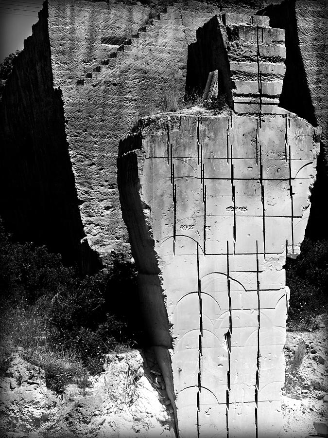 stone man - Last piece of limestone in a mediterranean quarry shows a human figure Photograph by Pedro Cardona Llambias