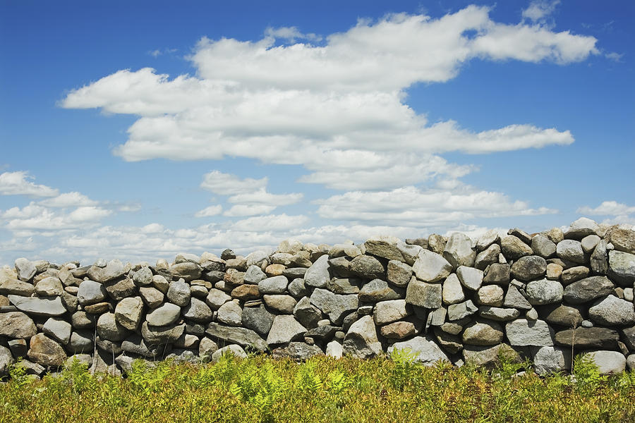 Stone Wall With Blue Sky And Clouds Photograph by Keith Webber Jr