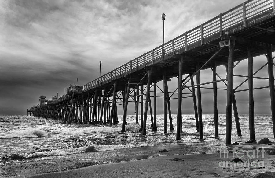 Storm Clouds Over The Pier Photograph by Eddie Yerkish