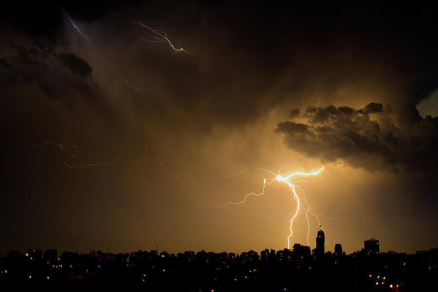 Storm over the City Photograph by Manuel Fuentes | Fine Art America