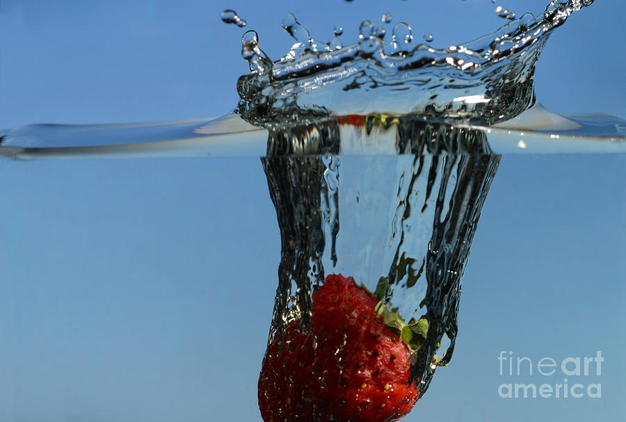 Strawberry Dropped Into Water Photograph by Ted Kinsman