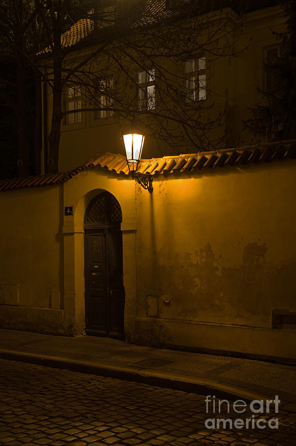 Street in Prague by night Photograph by Jorgen Norgaard