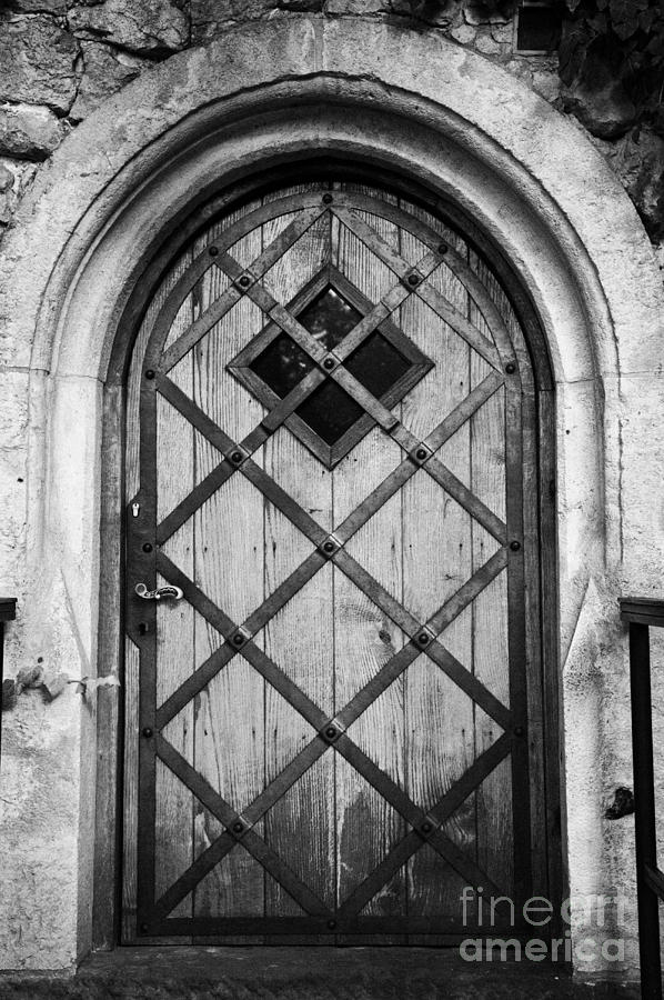 City Photograph - Strong Wooden Metal Braced Fortified Door For Strength In Wawel Castle Krakow by Joe Fox