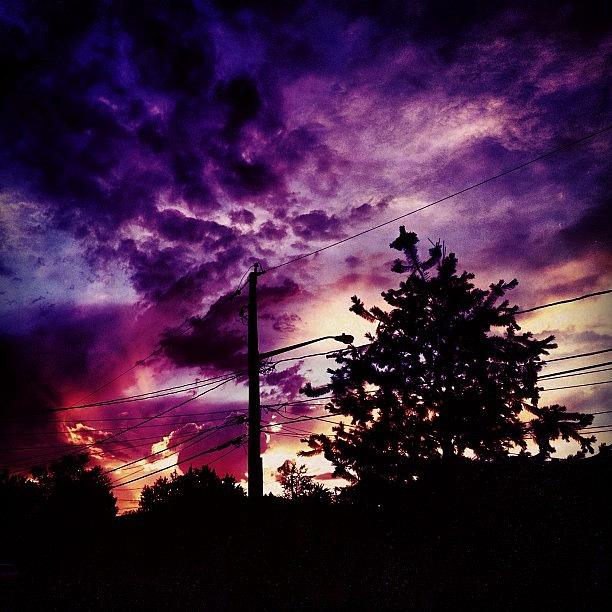 Nature Photograph - #stupidlightpost #sunset #clouds by Luis Pizarro