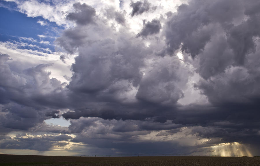 Farm Photograph - Sun Rays through Storm Clouds with Blue Sky by Jennifer Brindley