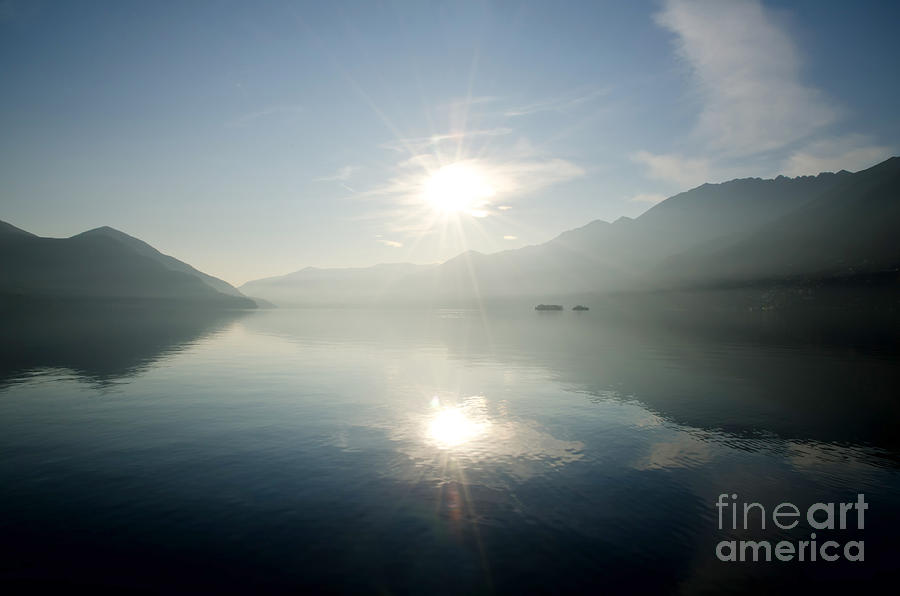 Sun reflections on a lake Photograph by Mats Silvan