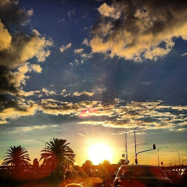 Traffic Photograph - Sun Setting On The Drive Home In Mawson by Rhys Moult