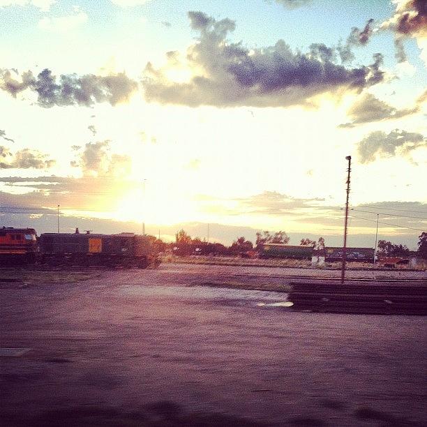 Sunset Photograph - Sun Setting Over Dry Creek Train Yard by Andrew Coulson