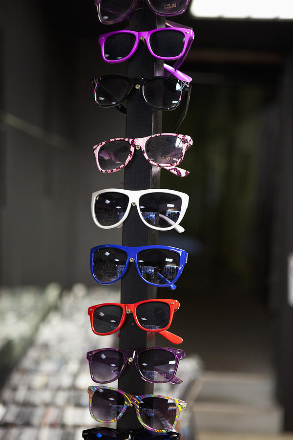Sunglasses On Display In A Store Photograph by Halfdark