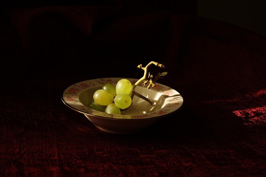Sunlit Grapes on Red Photograph by Margie Avellino
