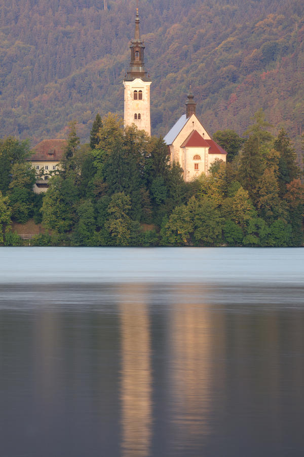 Sunrise over Lake Bled and the island church Photograph by Ian Middleton