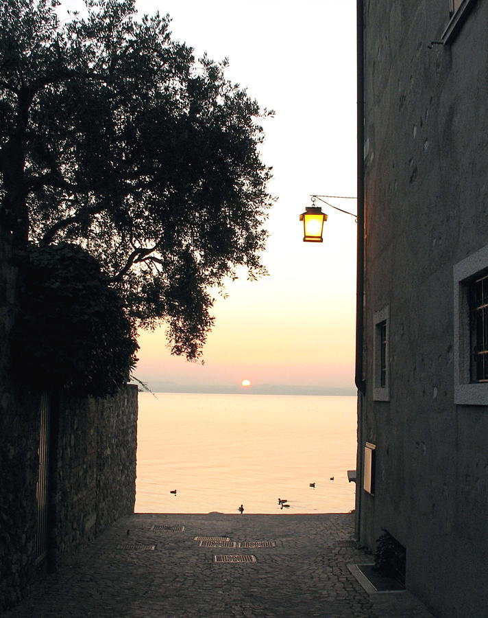 Sunrise over Lake Garda Photograph by Vikki Bouffard