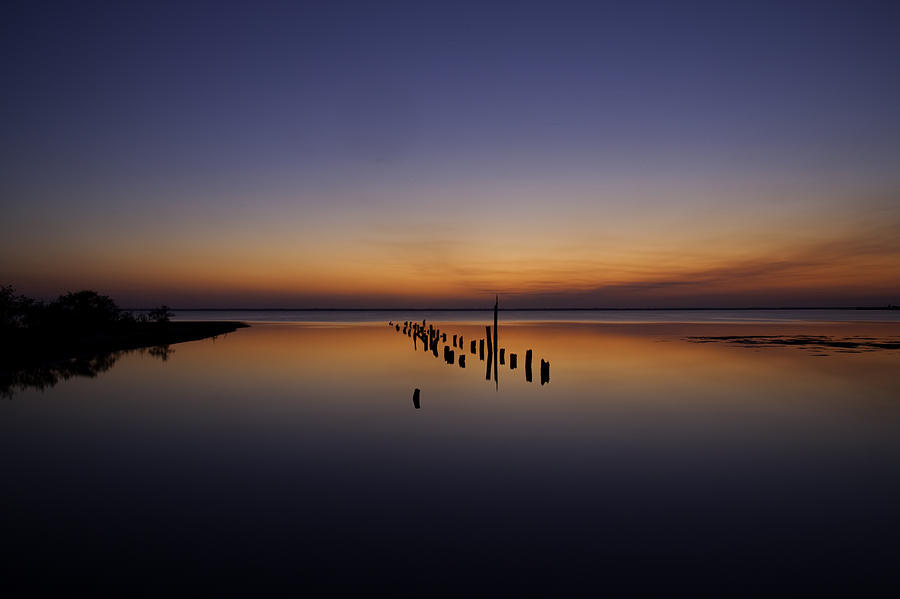 Sunset and Pilings Photograph by Rich Franco