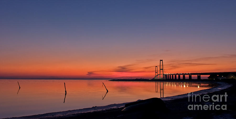 Sunset by bridge Photograph by Jorgen Norgaard