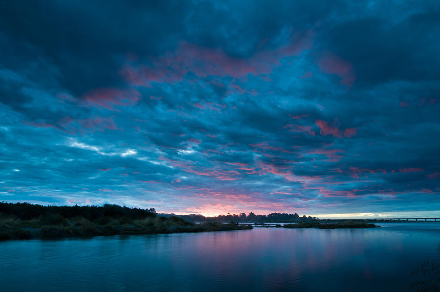 Sunset over a river  Photograph by U Schade