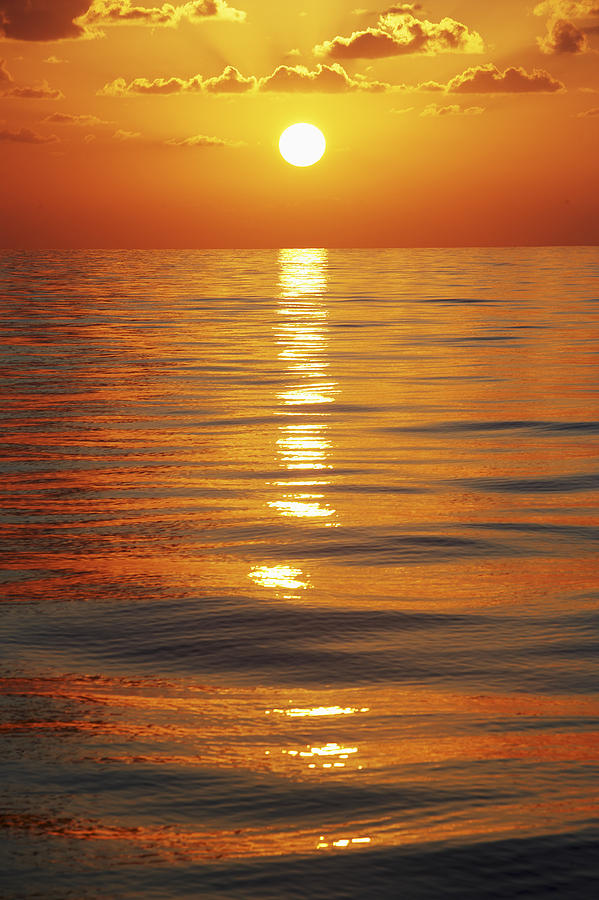 Sunset Photograph - Sunset Over Ocean Horizon by Axiom Photographic