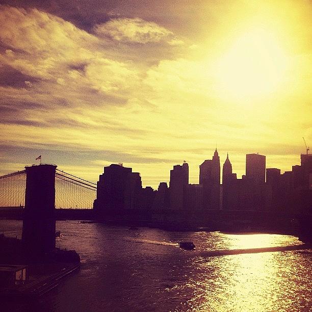 Brooklyn Bridge Photograph - Sunset Over the New York City Skyline and the Brooklyn Bridge by Vivienne Gucwa