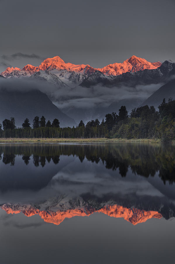 Sunset Reflection Of Lake Matheson Photograph by Colin Monteath