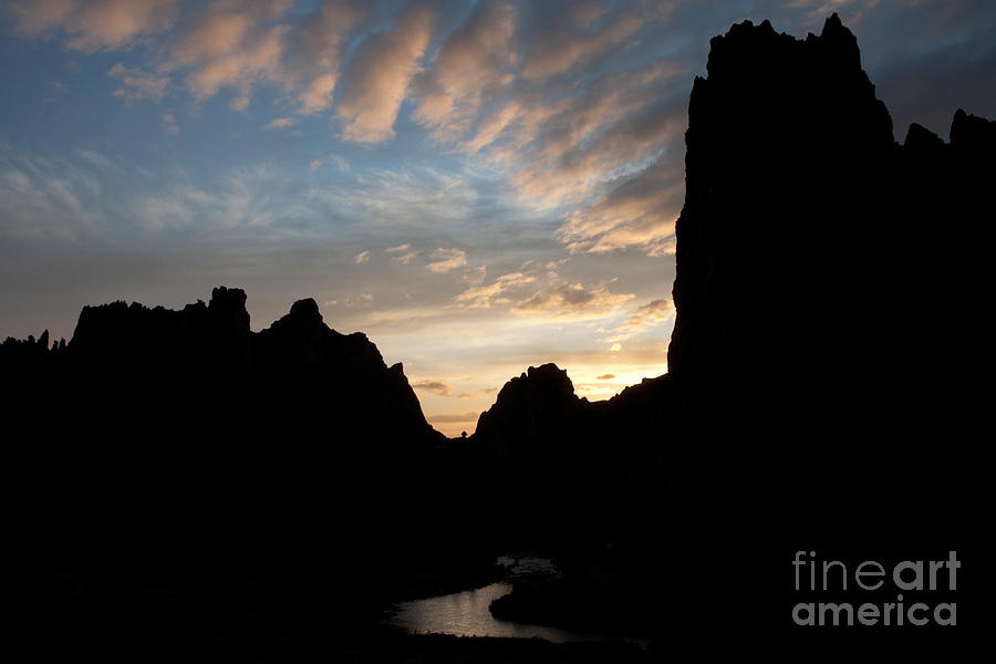 Sunset with Rugged Cliffs in Silhouette Photograph by Karen Lee Ensley