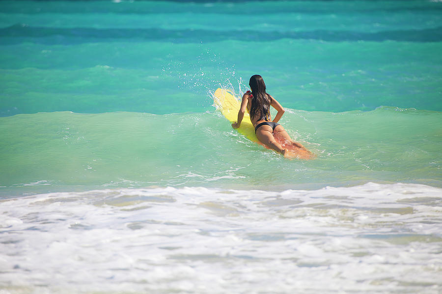 Paradise Photograph - Surfer Girl Paddling Out by Tomas Del Amo - Printscapes