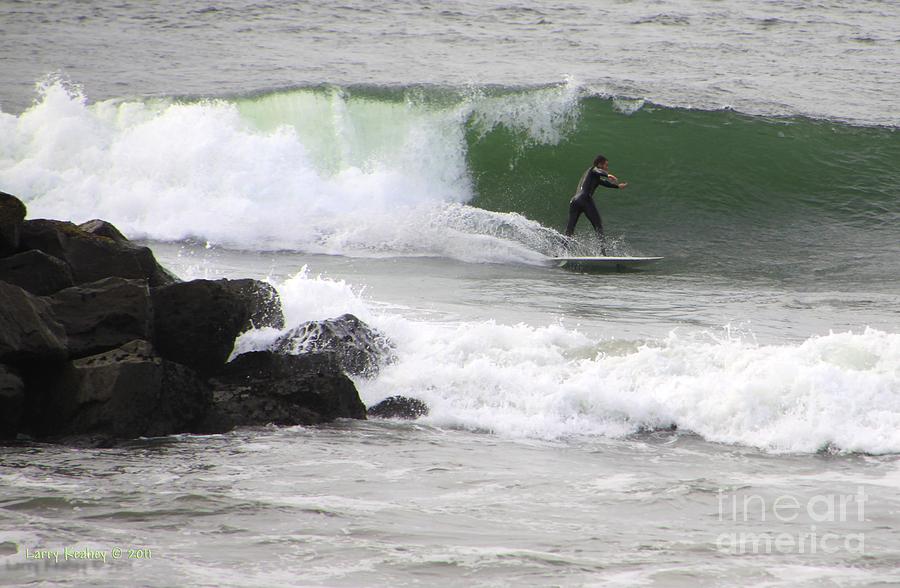 Sports Photograph - Surfin Around The Rock by Larry Keahey