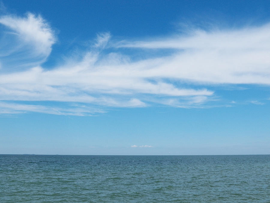 Sweeping Clouds Across the Water Photograph by Corinne Elizabeth Cowherd