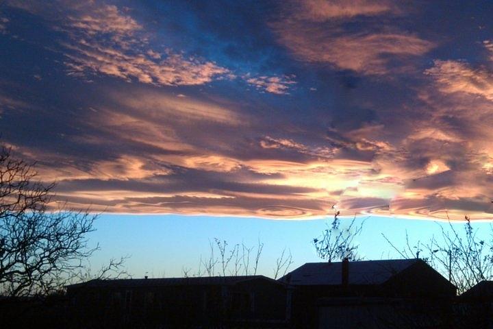 Sunset Photograph - Swirley Clouds by Sandi Owens