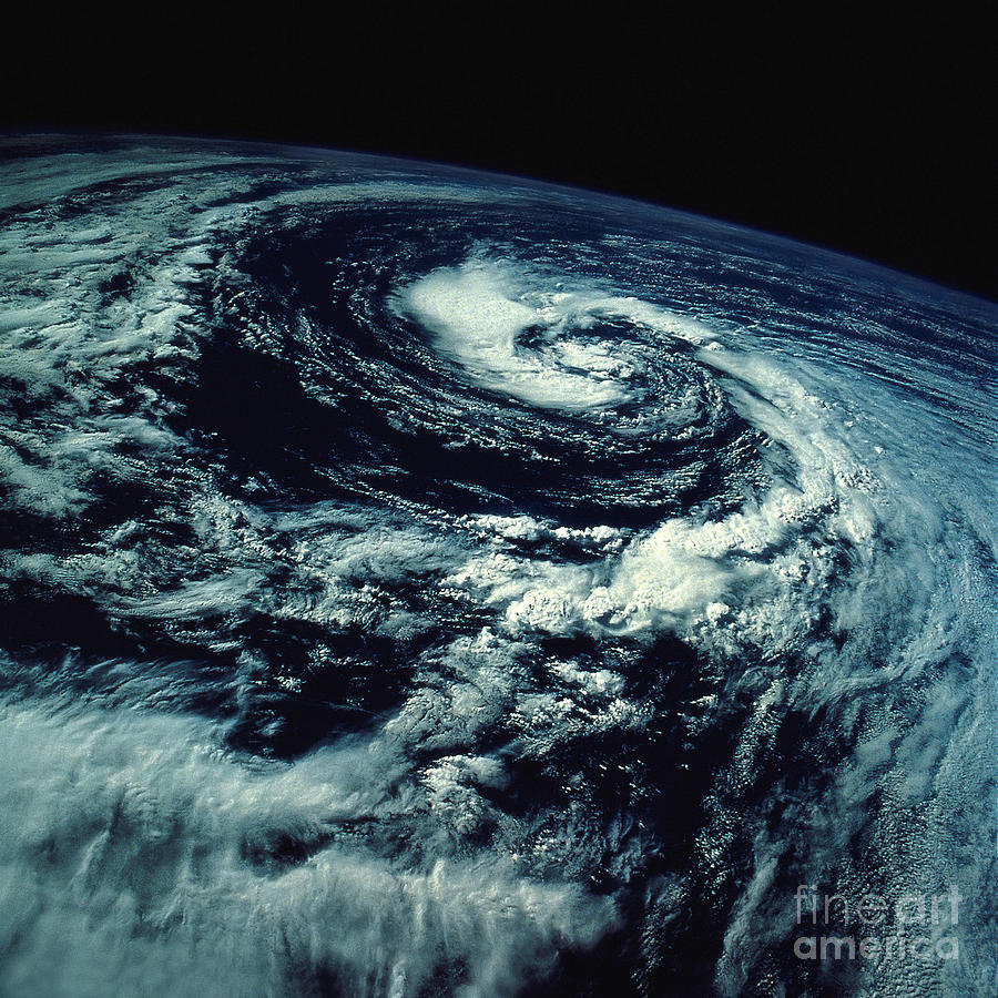 Space Photograph - Swirling Clouds From Space by Stocktrek Images