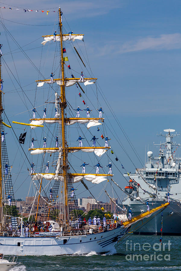 Tall ship Dewaruci Greets a Naval Vessel Photograph by Susan Cole Kelly