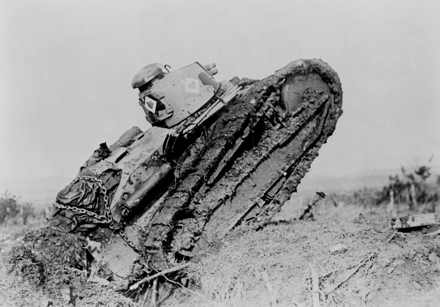 Tank ploughing its way through a trench and starting toward the German line during World War I  Photograph by International  Images