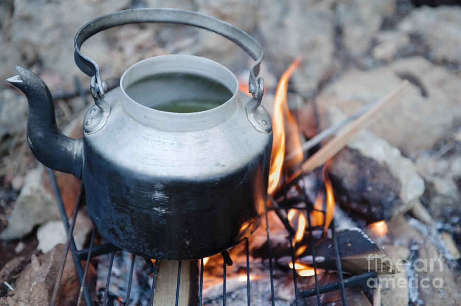 Teapot on campfire Photograph by Noam Armonn - Pixels
