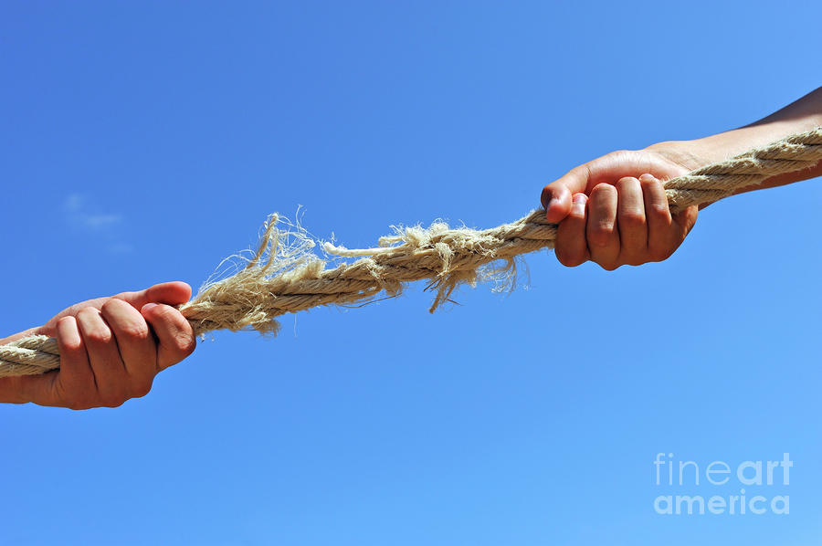 Rope Photograph - Teenagers hands playing tug-of-war with used rope by Sami Sarkis