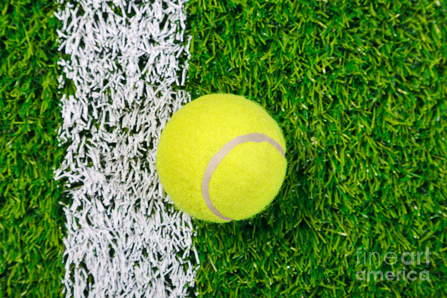 Tennis Photograph - Tennis ball on grass from above. by Richard Thomas