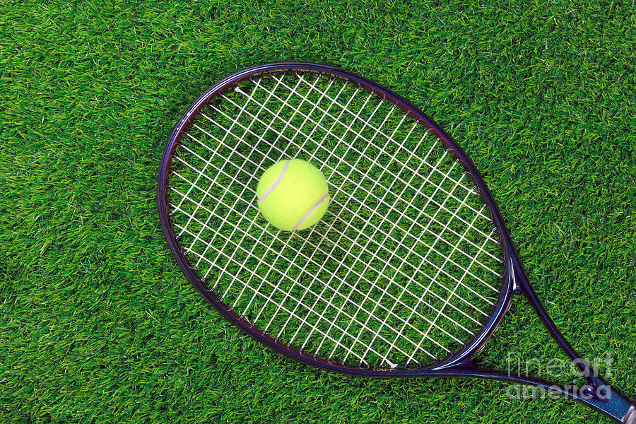 Tennis Photograph - Tennis raquet and ball on grass by Richard Thomas