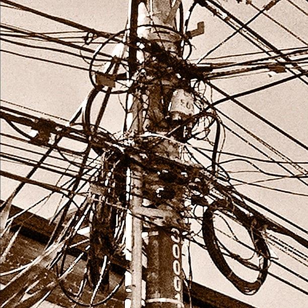 Nostalgia Photograph - The Cable Work Of This Guys Is So Messy by Martin Endara